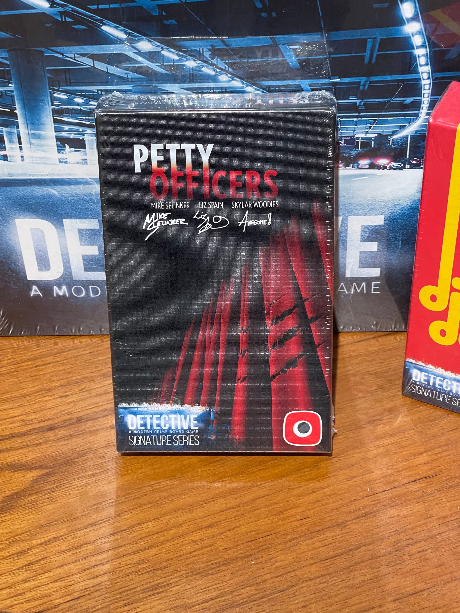 Front cover Petty Officers - Expansion set for Detective: A Modern Crime Board Game. The expansion was written by famous Mike Selinker, together with Liz Spain, Skylar Woodies and the Lone Shark Games team. This time in the investigation the pets will help their owners! Petty Officers is an expansion to the legendary criminal board game Detective by Ignacy Trzewiczek. For sale at Conundrum House and https://conundrum.house